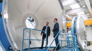 Benedikt Gundling and Tobias Hannen in front of a tank component of the Ariane 6. (Source: Grob Works)