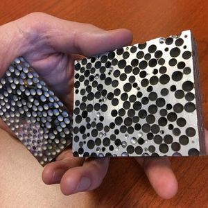 CMFs are foams that consist of hollow spheres – made of materials such as stainless steel, nickel, or other metals and alloys – embedded in a metallic matrix. The resulting material is both lightweight and remarkably strong at absorbing compressive forces.(Source:  Jie Sun/ NC State University)