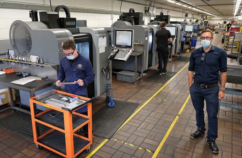 The line of three VM5i machining centres, the smallest model manufactured by Hurco, in the toolroom at plastic packaging manufacturer Berry M&H, Beccles. Kurt Knights is pictured right. (Hurco)
