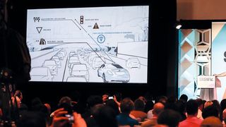 Wilko Stark, Vice President Daimler & Mercedes-Benz Cars Strategy and Product Planning sowie CASE-Chef bei seinem Vortrag „Five things you didn’t know about self-driving cars“. (Daimler)