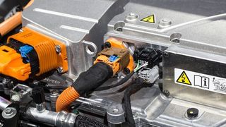 An electric motor uses electricity stored in batteries to power electromagnets which ultimately drive the vehicle axle.