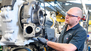 Assembly of turbochargers on MTU engines at Rolls-Royce Power Systems.