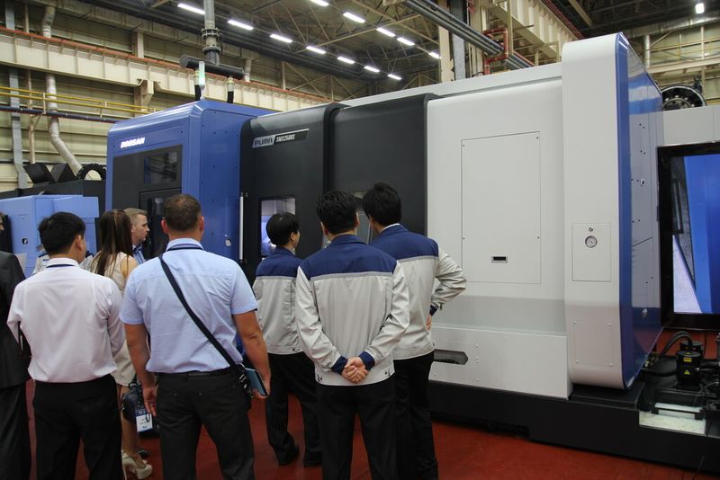 . . . and both visitors and Doosan employees were enthralled. (Source: Fouhy)