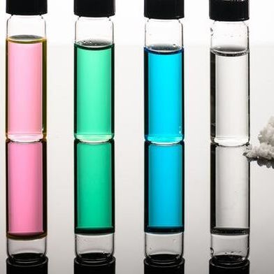 Vials of seawater, Great Salt Lake water, nickel sulfate, copper chloride wastewater, and desalinated water, along with recovered salts show how a new approach developed by URochester researchers turns natural and industrial waters into fresh water and reusable minerals. (Source: J. Adam Fenster / University of Rochester)