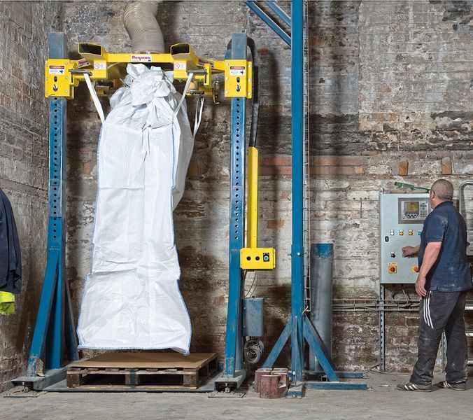 Adjustable fill head raises and lowers to suit a range of bag heights. An oversized filling spout accommodates open-top bags. (Flexicon)