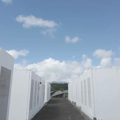 Rows of batteries on Kauai island provide more than just power: They stabilize the grid. A project between the Kauai Island Utility Cooperative, NLR, and several more partners showed that electronics can offer equal grid strength to spinning resources.  (Source: Connor O’Neil, National Laboratory of the Rockies)