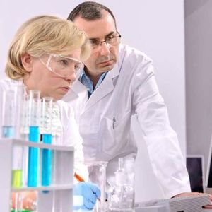 Personnel maintaining and documenting modifications that have been carried out since the previous shift cycle at a pharmaceutical factory