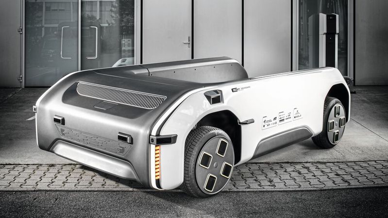 Mithilfe patentierter Trag- und Führungsgelenke: Das futuristische Fahrzeugkonzept U-Shift des DLR kann dank seiner speziellen Konstruktion mit Hubmechanismus wechselweise Güter oder Personen transportieren.(Bild:  Institut für Fahrzeugkonzepte / DLR)