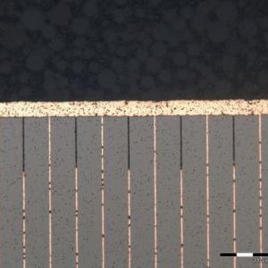 Bild 1: Schnitt durch einen EPCOS Kupfer-Piezo-Aktuator der dritten Generation. Durch selektives Ätzen der Isolationsschichten wird ein höheres aktives Volumen erzielt. 