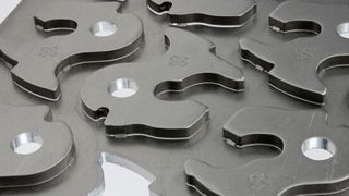 Bild 1: Feinschneiden gilt als hochpräzises Schneidverfahren. Mit neuen Pressen- und Werkzeugkonzepten wird die Ausbringungsleistung wesentlich gesteigert. (Bild: Feintool)