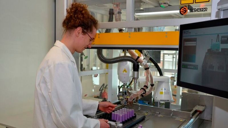 Project Manager Christian Schiller at a projection welding machine where battery cells are connected using copper connectors.(Source:  Fraunhofer ISE / Photo: Felix Thurn)