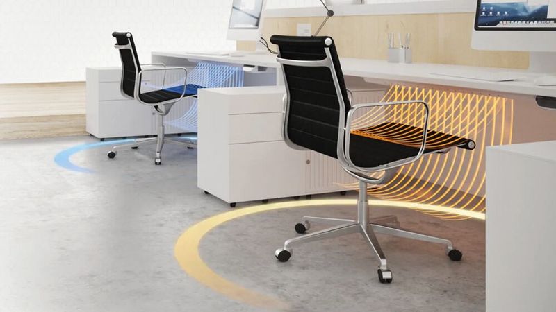 Die Einzelplatz-Klimatisierung „Tisch Klima“ wirkt sich nur auf den unmittelbaren Radius am Arbeitsplatz aus, sodass an jedem Platz im Raum ein individuelles Inselklima geschaffen werden kann.  (Bild: Carbon Heater GmbH)