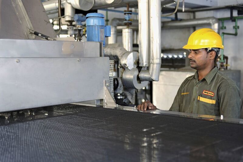 Uniform, dust-free pastilles of silica-supported nickel catalyst produced by the Sandvik Rotoform system make for easy handling with no hazardous dust.  (Picture: Monarch/India)