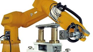 Bild 1: Ein Sechs-Achs-Knickarmroboter mit Wechselgreifersystem sorgt im Be- und Entladesystem für die nötige Flexibilität.  Bild: Faude (Archiv: Vogel Business Media)