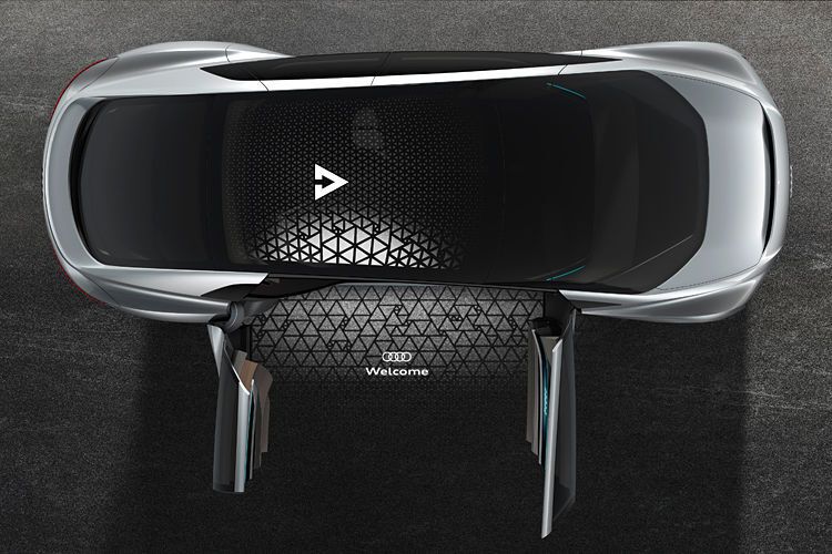 Die Türen des Audi Aicon öffnen sich gegenläufig und Beamer-Module projizieren Signale auf den Boden. (Audi)