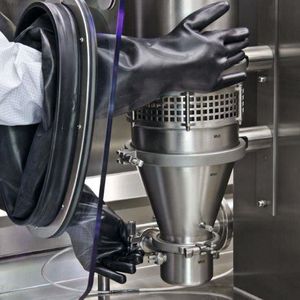 Gloves are used to change equipment in the glovebox.