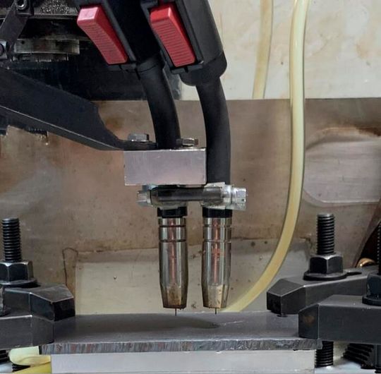 Part of the new hybrid setup developed by WSU researchers that creates parts using precise computer programming and two welding heads. It uses commonplace, relatively inexpensive tools, so manufacturers and repair shops could potentially use this method in the near future. Part of the new hybrid setup developed by WSU researchers that creates parts using precise computer programming and two welding heads. It uses commonplace, relatively inexpensive tools, so manufacturers and repair shops could potentially use this method in the near future.