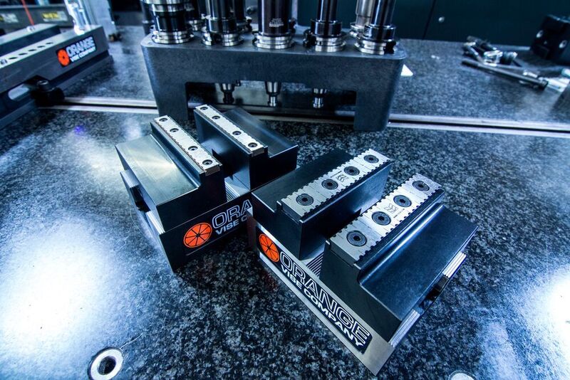 The new Orange Delta IV compact vices and zero-point subplates for use in multi-axis and high-density milling set-ups. (Leader Chuck)