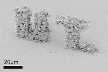 The abbreviation 'UT.' (University of Twente) 3D printed in gold. (University of Twente)