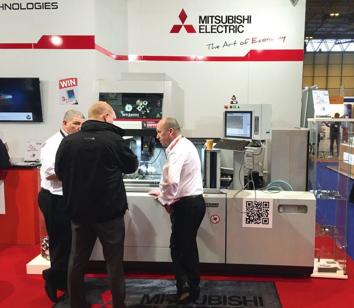 A busy HK Technologies booth at Mach 2016, featuring the MV 2400 EDM machine. (Pulse PR)