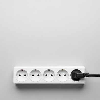 The article explains power strips and their role in solving outlet problems. (Source: © Dara - stock.adobe.com)
