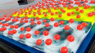 Auf einer Silizium-Oberfläche organisieren sich Silizium-Atome zu Paaren, welche wie eine Wippe zwei verschiedene Positionen einnehmen können. Die Wechselwirkung zwischen den Wippen führt zu langreichweitiger und richtungsabhängiger Ordnung. Analog zum frühen Universum hängt die Größe der geordneten Bereiche von der Abkühl-Geschwindigkeit der Oberfläche ab.  (Bild: B. Schröder/HZDR)