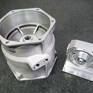 Pictured right is the aerospace component machined in one hit from a solid aluminium billet. On the left is the aluminium casting for the rail industry which, by mounting two at a time on the trunnion, can be completely machined in Ops 1 and 2, without the need for a third operation.(Source:  Whitehouse Machine Tools)