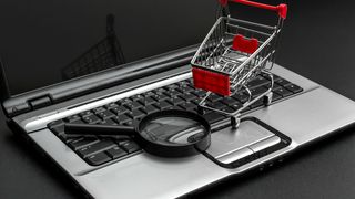shopping-cart-with-magnifying-glass-and-laptop-on-black-background-find-purchase-online-stockpack-adobe-stock-scaled (Quelle: igorkol_ter-Adobe Stock)