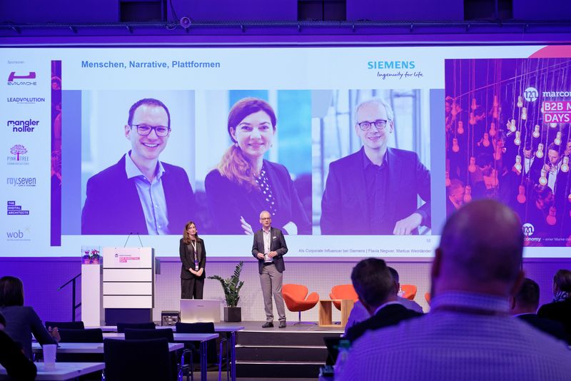 Flavia Negwer & Markus Weinländer, Siemens AG Die Reichweiten in Social Media steigen immer mehr an. Deshalb hat sich Siemens dazu entschlossen, einige Mitarbeiter und Vorstände mit Trainings zu Corporate Influencern auszubilden. Damit steige nicht nur die Reichweite für Siemens als Unternehmen, auch viele kleinere Fokusthemen können durch die Corporate Influencer besetzt werden. „Habt Mut zu neuen Formaten. Probiert vieles aus und nutzt dann das, was am besten funktioniert hat“, gibt Markus Weinländern mit auf den Weg.  (marconomy © Andreas Burkhardt )