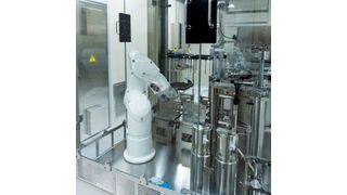 The stand-alone solution is equipped with a robotic arm that picks up the nest in the tub containing the empty PFSs and positions it under the two filling heads connected to peristaltic pumps. (Source: Steriline)