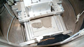 Researchers print Neil Armstrong's famous footprint from lunar dust simulant during a parabolic flight. (BAM)