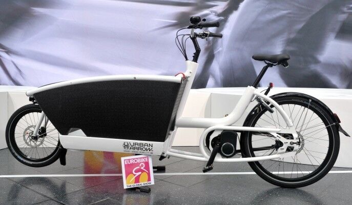 Urban Arrow This cargo bike with the “convertible” front box helps you get the kids to their destination safe and dry and can also be equipped with a rain tent or fly screen. (Image source: EUROBIKE Friedrichshafen)