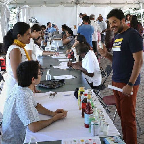 Senior study author Dr. Namratha Kandula (left) sharing information on salt and diet during a community medicine event. (Source:  Northwestern University)