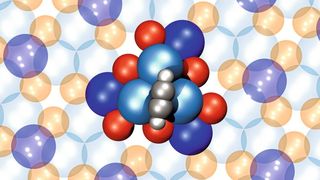 Atomares Strukturmodel eines einzelnen 4-atomigen Acetylen-Rotors (grau-weiße Kugeln) auf der chiralen PdGa Oberfläche (blaue Kugel -> Palladium, rote Kugeln -> Gallium). Die 12 Atome des Stators auf der PdGa Oberfläche und die 4 Atome des Acetylen-Rotors sind hervorgehoben. (Bild: Empa)