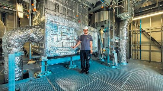 Lukas Geissbühler, Head Thermal Systems at Synhelion, with DAWN's thermal energy storage.(Source:  Synhelion)