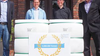 Production Manager Konrad Brunner (right) and a part of his team present the 4,000,000th tonne of viscose fibres produced by Kelheim Fibres. (Kelheim Fibres)
