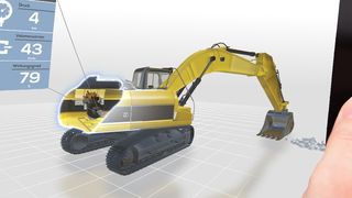 Besucher des KIT-Standes können in einem realen Bagger-Führerhaus alle Schalthebel ausprobieren und dabei Löcher in den Messeboden graben oder Passanten den Weg mit Sandhaufen versperren (Bild: KIT/Andreas Rüdenauer)