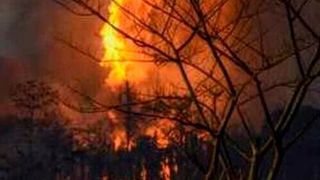 The massive fire at the oil well in Assam could be seen from 10 km away.  (PTI)