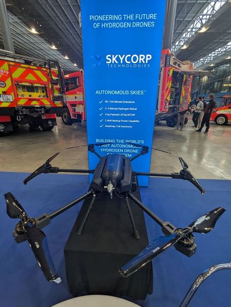 A SKYCORP hydrogen-powered multirotor drone on display. The accompanying specifications list 90–120 minutes of endurance, a 5 kg payload and a 24 kg maximum takeoff weight; the company positions the platform for defense reconnaissance, emergency response and other dual-use autonomous missions. (Source: SKYCORP Technologies OÜ)