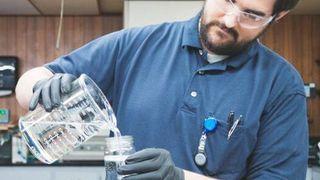 MFG Chemical lab scientist is testing to ensure there is no contaminant in the Dioctyl Sodium Sulfosuccinate (Doss) prior to shipment.  (Business Wire)