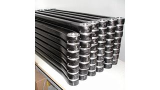 3200 CFK-Roboterarme für Kuka. Sie wiegen weniger als die Hälfte der üblichen Aluminiumversion und beim Hauptarm konnte durch ein spezielles Bauverfahren das Getriebe direkt an die CFK-Struktur angebunden werden. (Bild: Avantgarde Technologie)