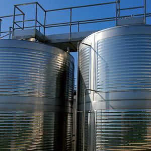 Aluminium barrels where grape juice is fermeted into wine in a modern wine factory. 