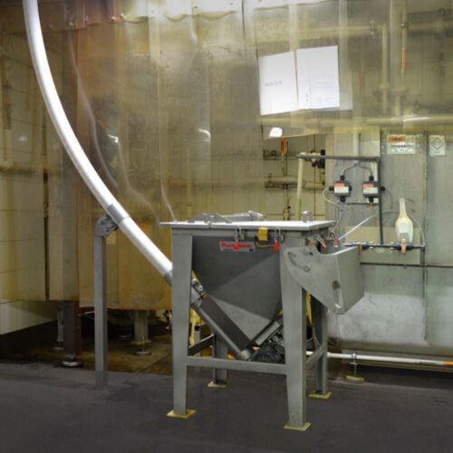 The conveyor exits the hopper at a 45 degree incline and curves to vertical, elevating the material 5.5 m (18 ft) to the dosing system inlet dust-free. The conveyor exits the hopper at a 45 degree incline and curves to vertical, elevating the material 5.5 m (18 ft) to the dosing system inlet dust-free.