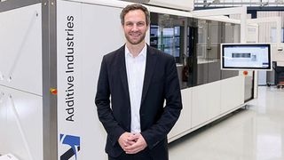 Simon Hoeges, GKN AM director, in front of the Metal-FAB1, an industrial-grade additive manufacturing machine. (GKN Sinter Metals)