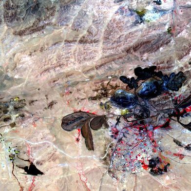 The mine in Baiyun Ebo, Inner Mongolia, China, which is the site of almost half the world's rare earth element (REE) production. The satellite image covers an area of 15 × 19 km. (Source: Wiki Commons, NASA/GSFC/METI/ERSDAC/JAROS & U.S. / Japan ASTER Science Team, Public domain)