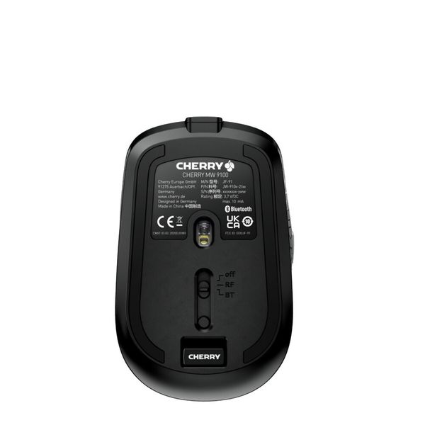 Ein Schalter an der Unterseite der MW 9100 erlaubt die Wahl zwischen Bluetooth oder USB-Empfänger für die Funkübertragung. Der USB-Empfänger sitzt beim Transport in einer magnetischen Aufnahme hinter dem Schalter. (Cherry)