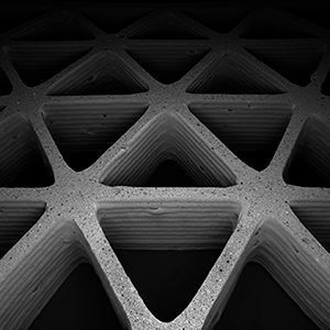 Harvard and MIT researchers 3D printed lightweight hexagonal and triangular honeycombs, with tunable geometry, density, and stiffness using a ceramic foam ink. (James Weaver/Wyss Institute)