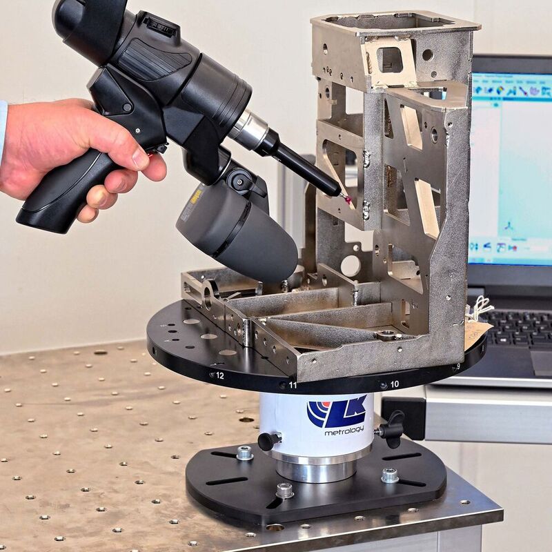 Mounted on a mobile workstation, LK Metrology's new Freedom Index Table being used to speed the inspection of an assembly using an LK portable measuring arm of the same name.