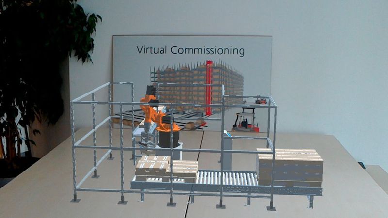 Hier zu sehen ist der Blick durch die Hololens von Microsoft. Damit kann der Benutzer mit der Unterstützung durch ein Natural User Interface interaktive 3D-Projektionen in der direkten Umgebung darstellen. (Machineering)