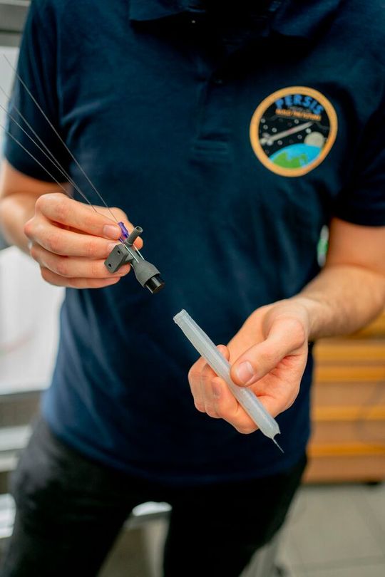 A 3D printed nozzle for use in space, made of fiber-reinforced photopolymer, along with a structural part.(Image: A. Ratzing / HM)